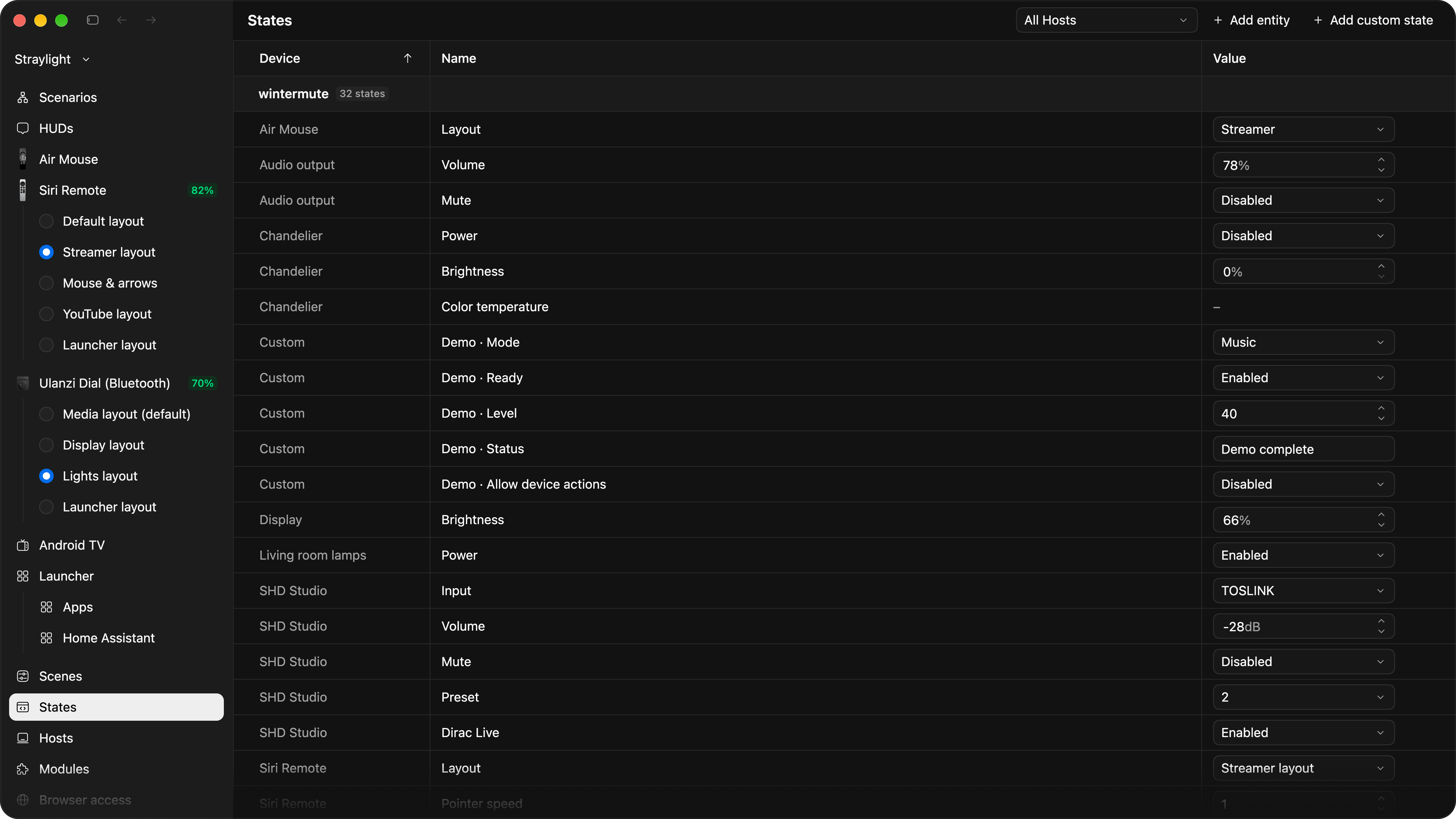 The States page in the editor: one table with Device, Name and Value columns grouped by Host, with wintermute's 32 States, among them Air Mouse layout, audio output volume and mute, the chandelier's power, brightness and colour temperature, custom demo states, display brightness, living room lamps and the SHD Studio's input.