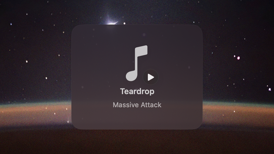 A square glass card with a music note, a play badge, the title Teardrop and the artist Massive Attack.